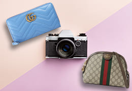グッチの財布とショルダーバッグとカメラ