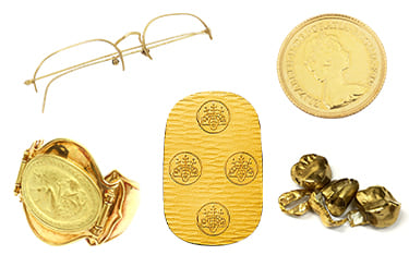 金の眼鏡とメダルブレスレットと小判と金歯とコイン