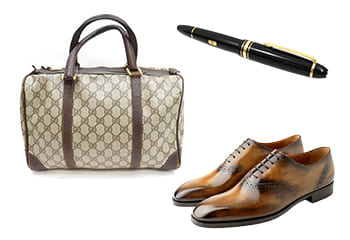 グッチのビジネスバッグとモンブランの万年筆とベルルッティの靴