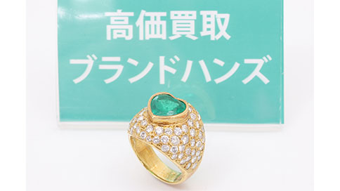 傷のあるK18のエメラルドダイヤリング