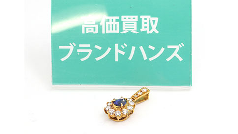 傷のあるK18のブルーサファイアトップ