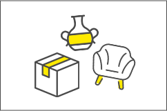 骨董品とソファーを段ボールに仕分ける